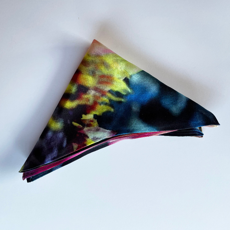 Square scarf folded corner, dark base with blue and pink floral brushstrokes