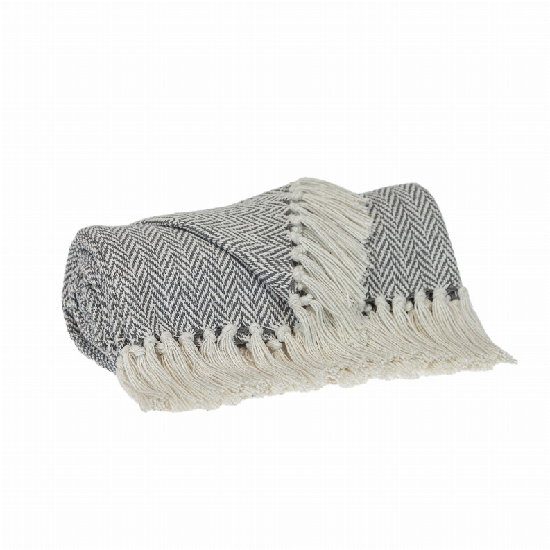 Cotton throw blanket with gray chevron pattern and off-white tassel fringe