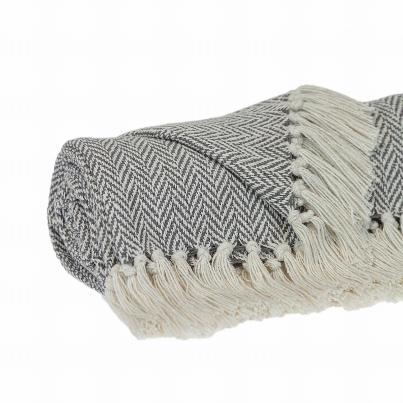Cotton throw blanket with gray herringbone weave, off-white tassel fringe