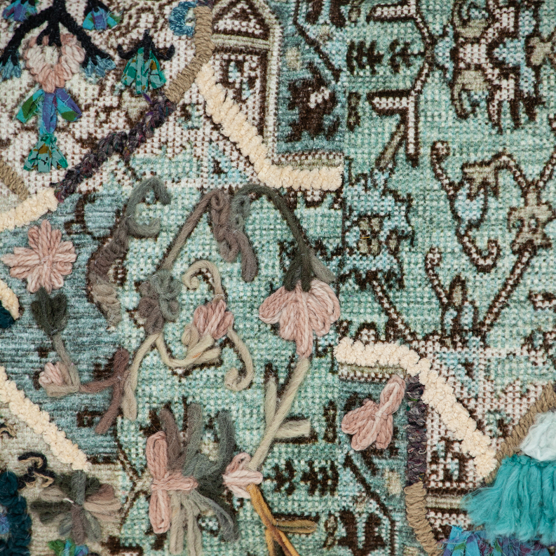 Parkland Collection Adya pillow cover detail, embroidered icons and teal thread pattern
