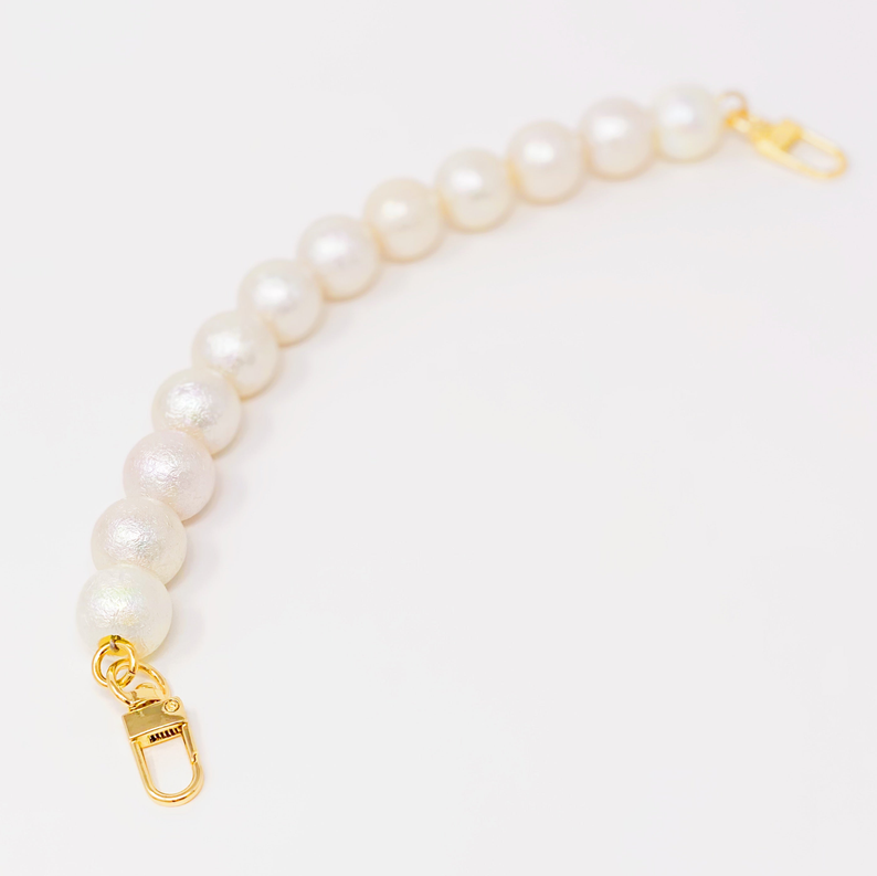 White pearl purse strap with gold clasp and swivel-style connector
