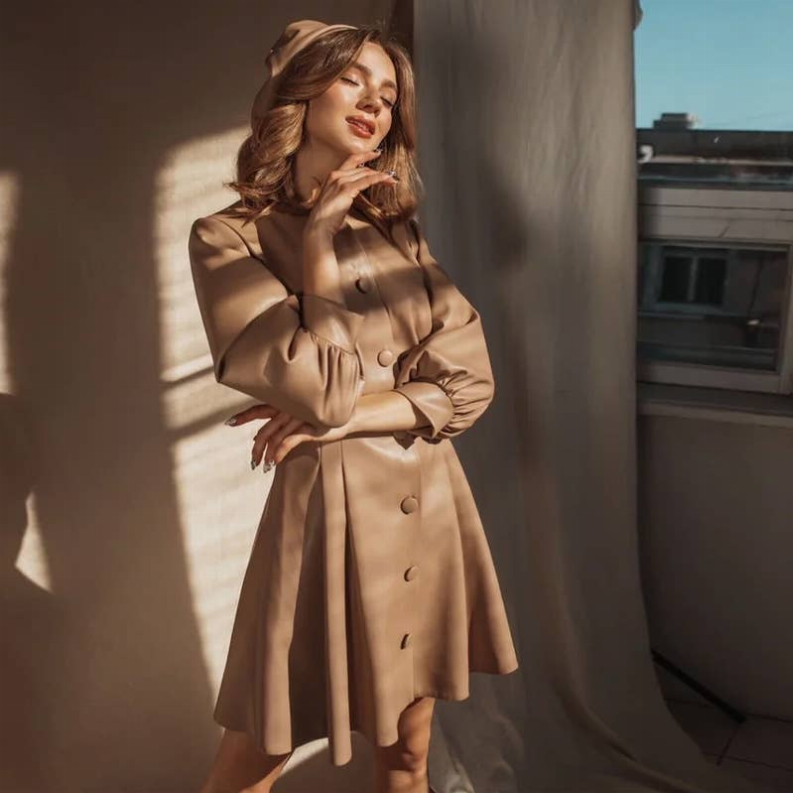 Khaki button-front belted dress with long sleeves and gathered waist, front view