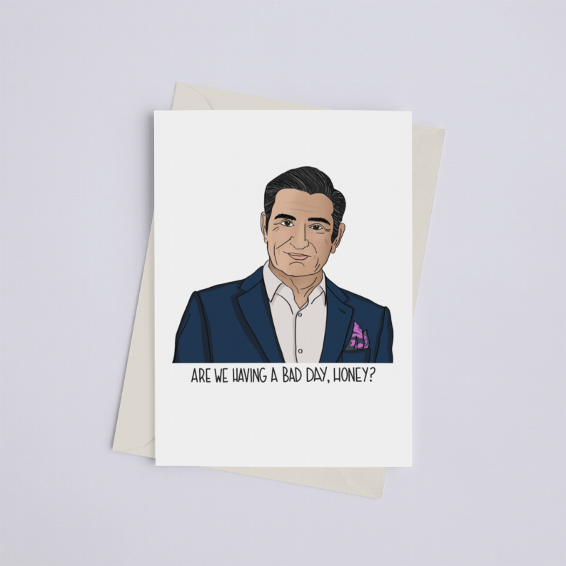 Greeting card with illustrated man in dark suit and purple pocket square; quote: Are we having a bad day, honey?
