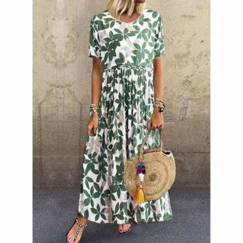 Green linen maxi dress with leaf print, short sleeves, gathered waist.