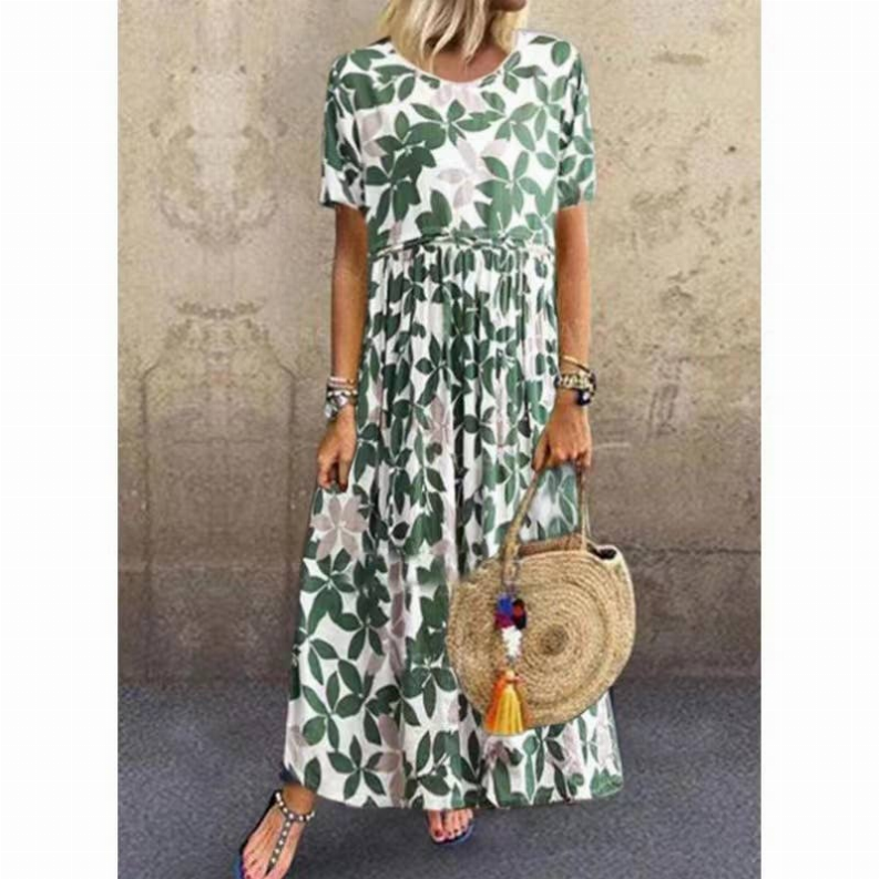 Forest green linen maxi dress with leaf pattern, round neck, pleated skirt.