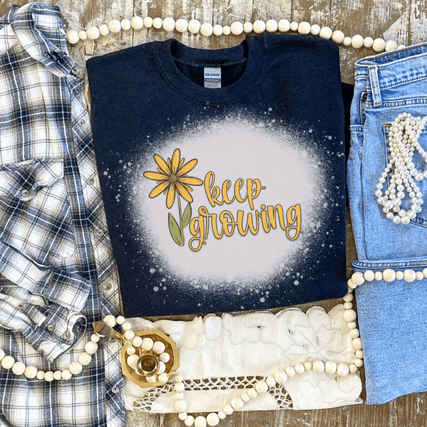 Keep Growing printed bleach-style T-shirt, dark crewneck with flower graphic