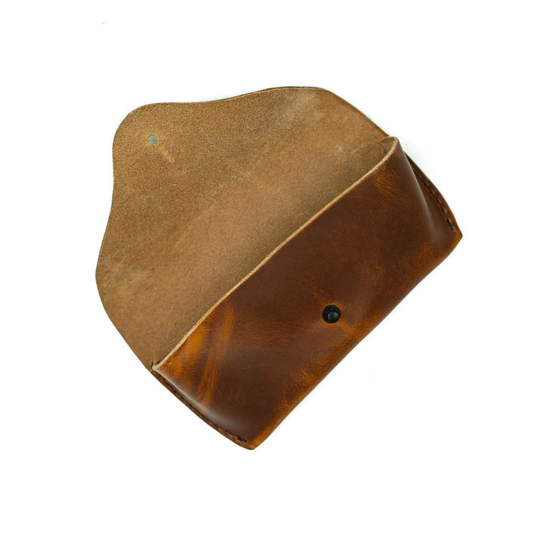 Brown leather sunglasses case with suede flap and snap button closure