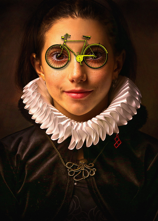 Close-up Victorian bicycle glass wall art, face with yellow bicycle glasses and white ruffled collar