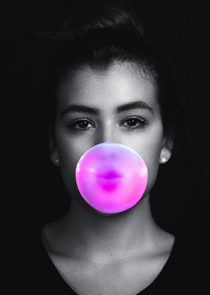 Framed wall art with woman's face and pink glowing bubble graphic