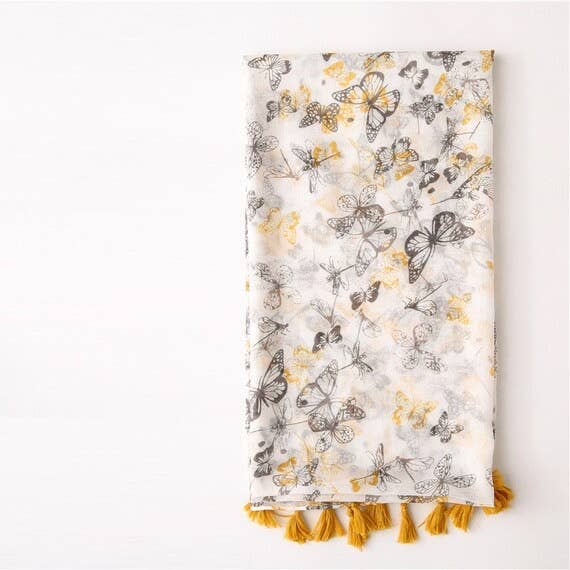 Voile scarf with butterfly print and yellow tassel fringe, folded view