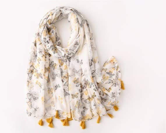 Voile butterfly print scarf with yellow tassels, draped loop