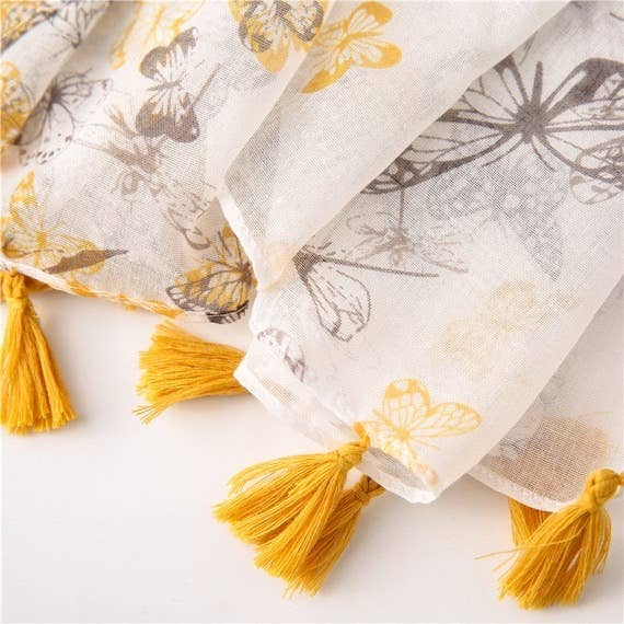 Voile scarf corner with butterfly print and yellow tassel fringe details