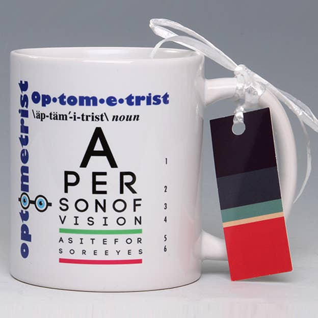 Whimsical optometrist mug, white with blue/red eye-vision typography and hanging tag