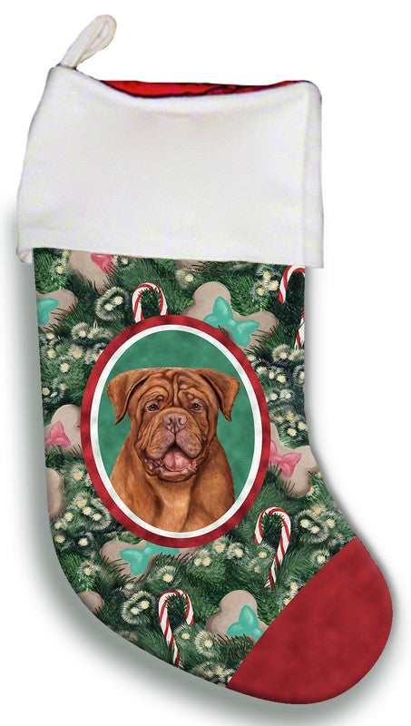 Holiday pet stocking: white cuff, green pattern, circular Dogue face emblem.