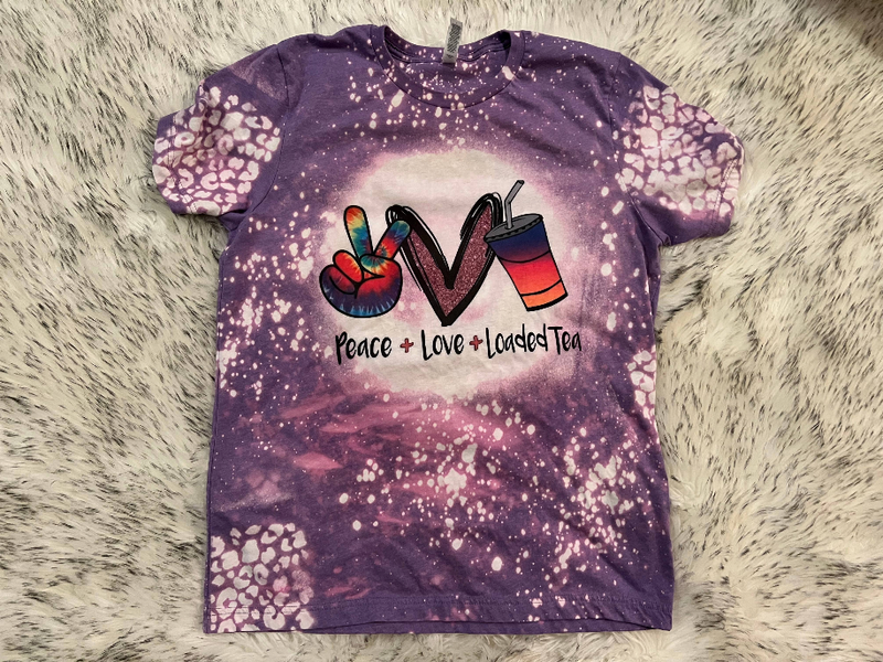 Purple speckled crewneck T-shirt with peace-love-loaded tea front graphic