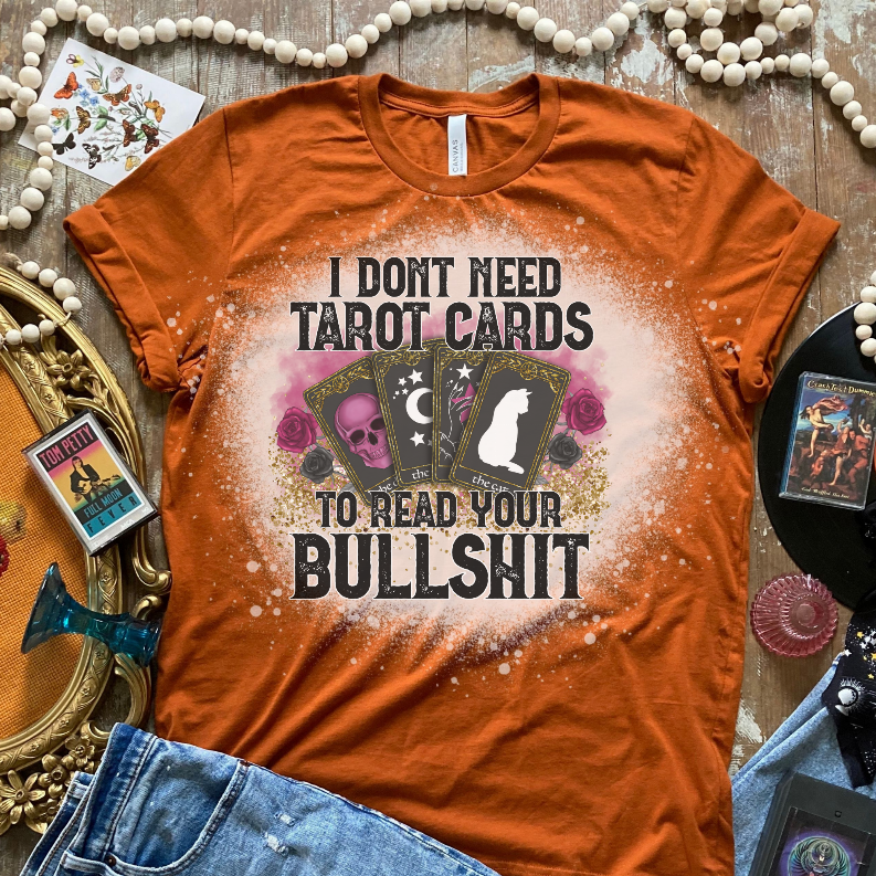 Burnt orange graphic T-shirt with 'I Don't Need Tarot Cards' slogan and art print