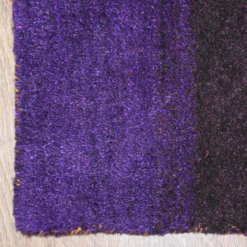 Silk-mix area rug close-up, dense purple pile with subtle speckled texture