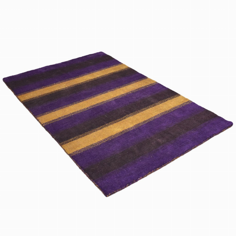 Diagonal view of striped area rug with purple, dark, and gold horizontal bands