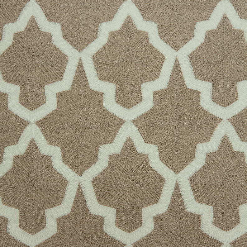 Close-up of beige and white geometric throw pillow with textured trellis pattern