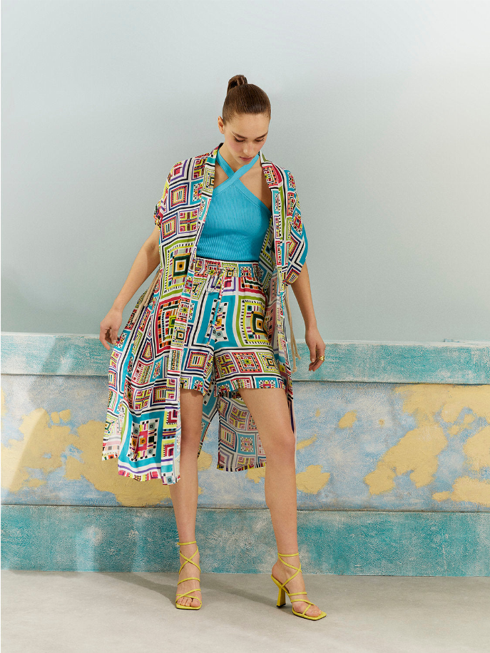 Printed kimono robe on model, geometric multi-color blocks, belted waist, knee length