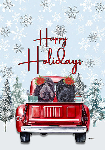 Happy Holidays holiday garden flag with two black Labradoodles in a red truck