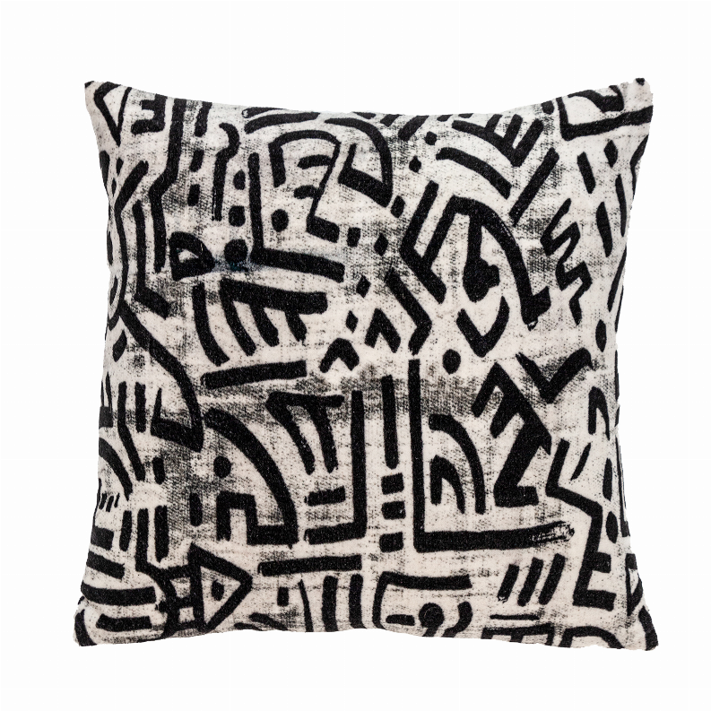 Cream square throw pillow with dense black geometric abstract pattern