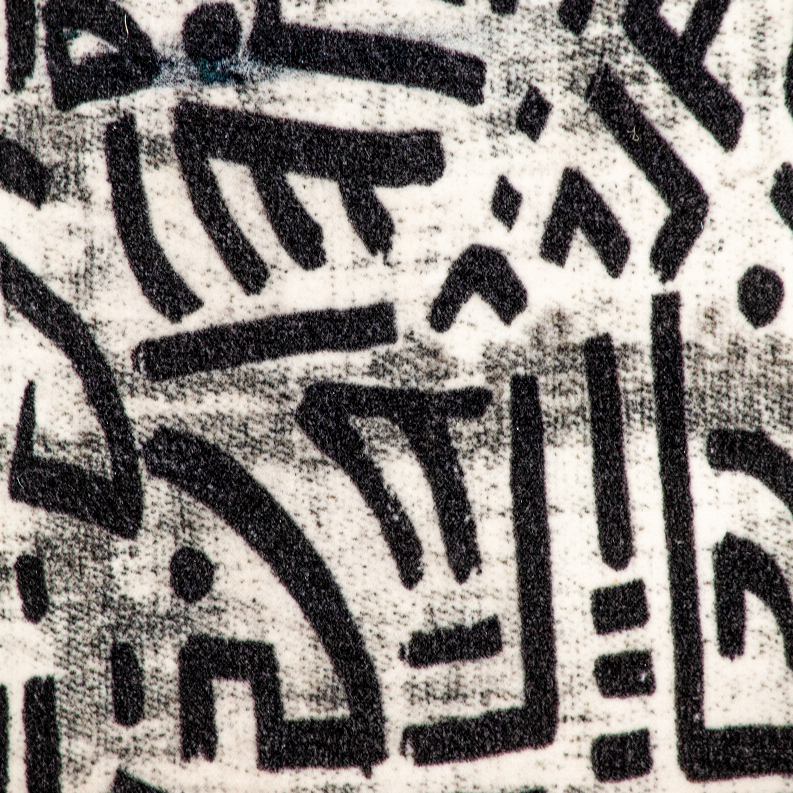 Close-up of cream and black geometric abstract throw pillow fabric