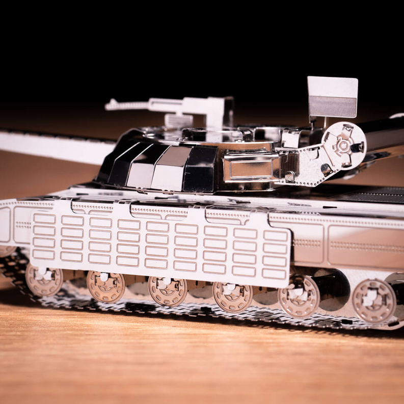 Metal tank model detail view with tread tracks and side armor panels