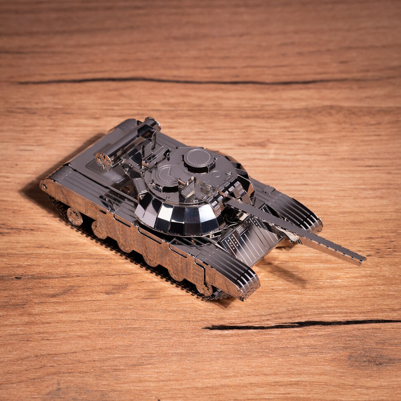 Dark metal tank model with top hatches and main gun