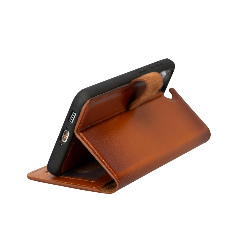 Tan leather wallet case folded open with phone holder and side strap