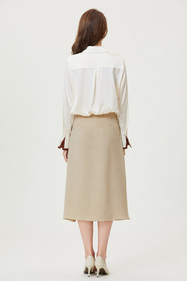 Back view of white silk button-up shirt with long sleeves and tie-neck collar