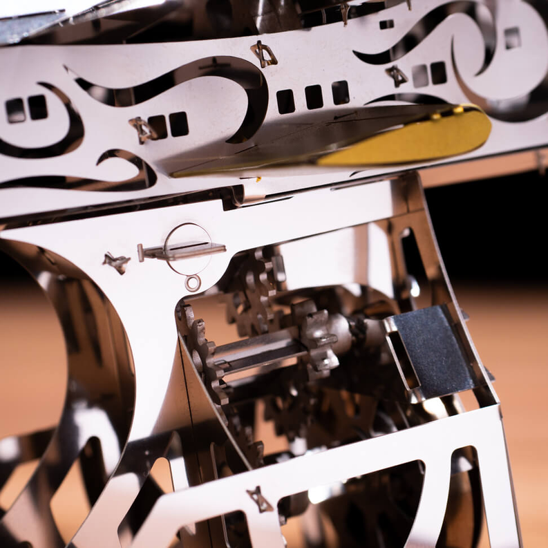 Mechanical aircraft model interior frame, white and gold close-up