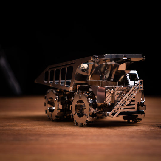 Metal mining truck model in bronze-brown with detailed chassis and tracks
