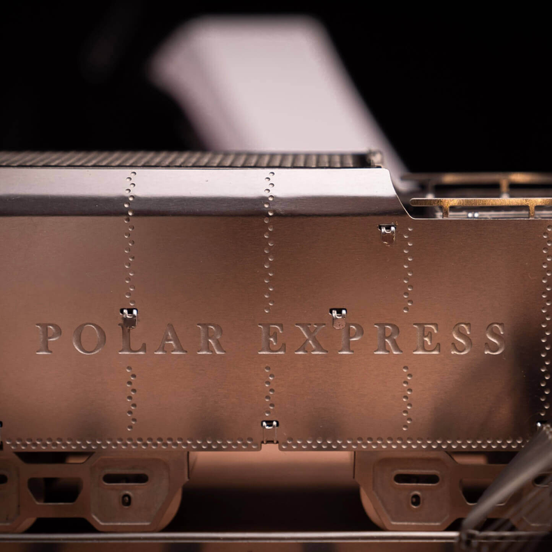 Brown metal steam locomotive side panel with “POLAR EXPRESS” lettering