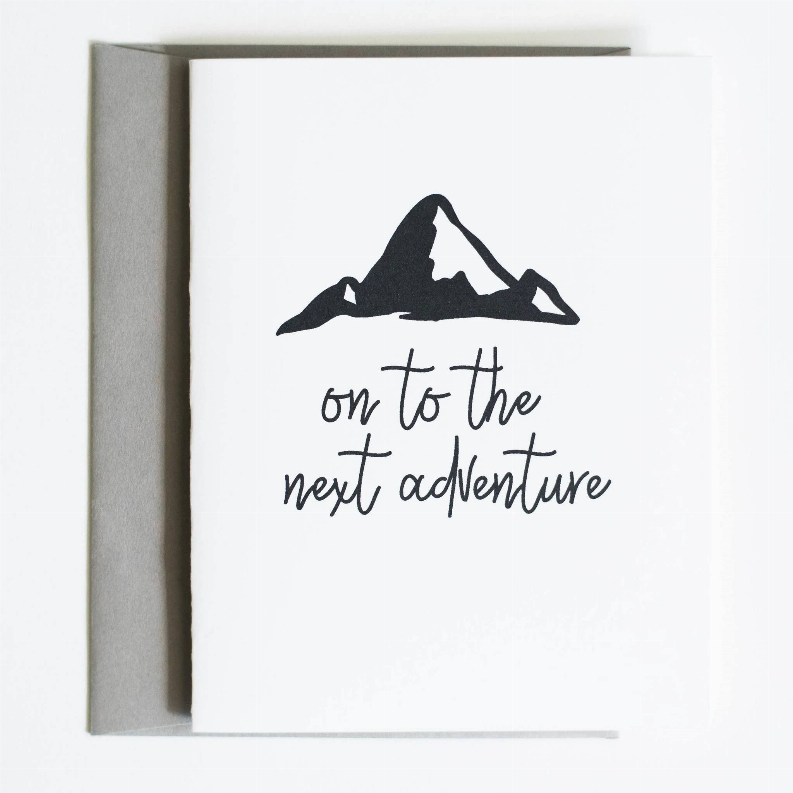 Adventure greeting card, white with black mountain and 'on to the next adventure'