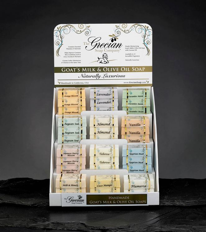 Goat's milk and olive oil bar soap display with assorted wrapped soap bars