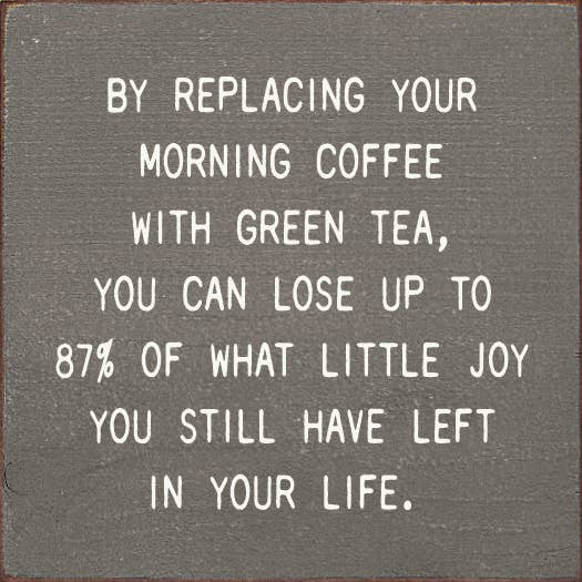 Gray square motivational quote wall plaque with white monospaced text about green tea