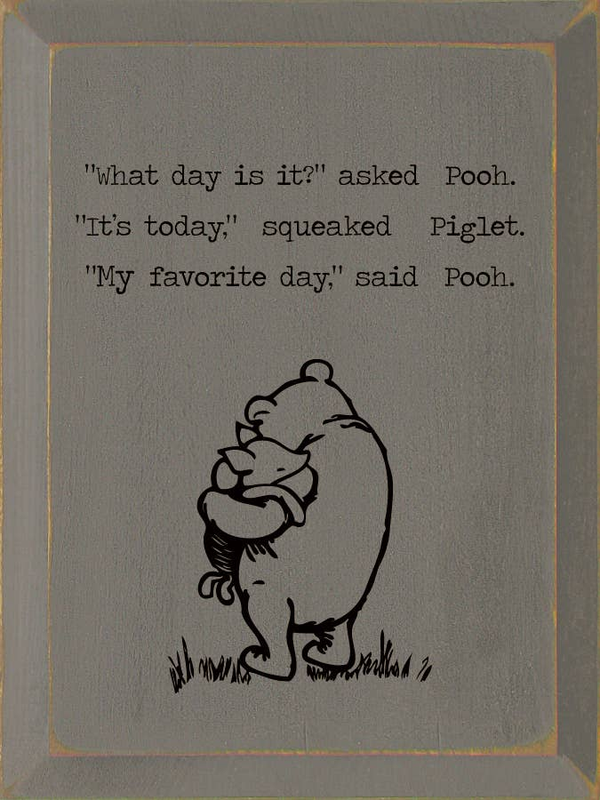 Framed wall art with Pooh and Piglet cartoon and quote text