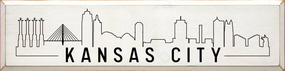 Framed Kansas City skyline wall art with building silhouettes and bold city name lettering