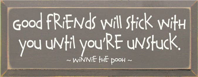 Rectangular wooden sign with quote: “Good friends will stick with you until you're unstuck.”