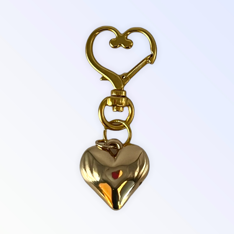 Gold-tone heart collar charm with lobster clasp and loop rings