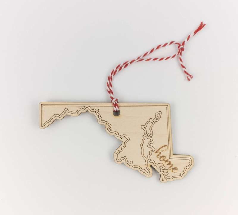 Maryland state wood Christmas ornament with engraved outline and red-white hanging cord