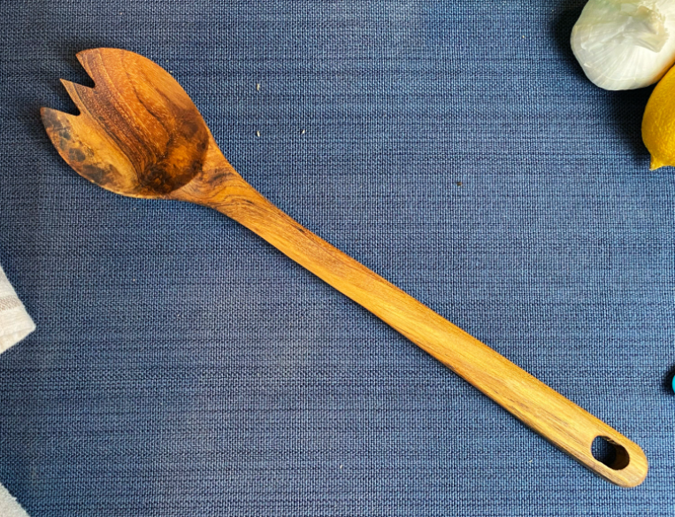 Wooden salad serving spork with spoon and fork ends, curved handle with hanging hole
