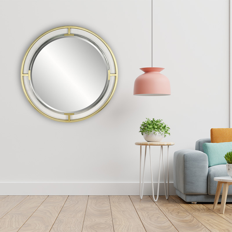 Wall-mounted round dresser mirror with gold openwork frame and reflective glass.