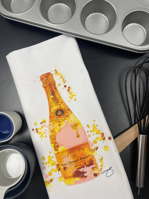 White tea towel with gold bottle illustration and splatter print