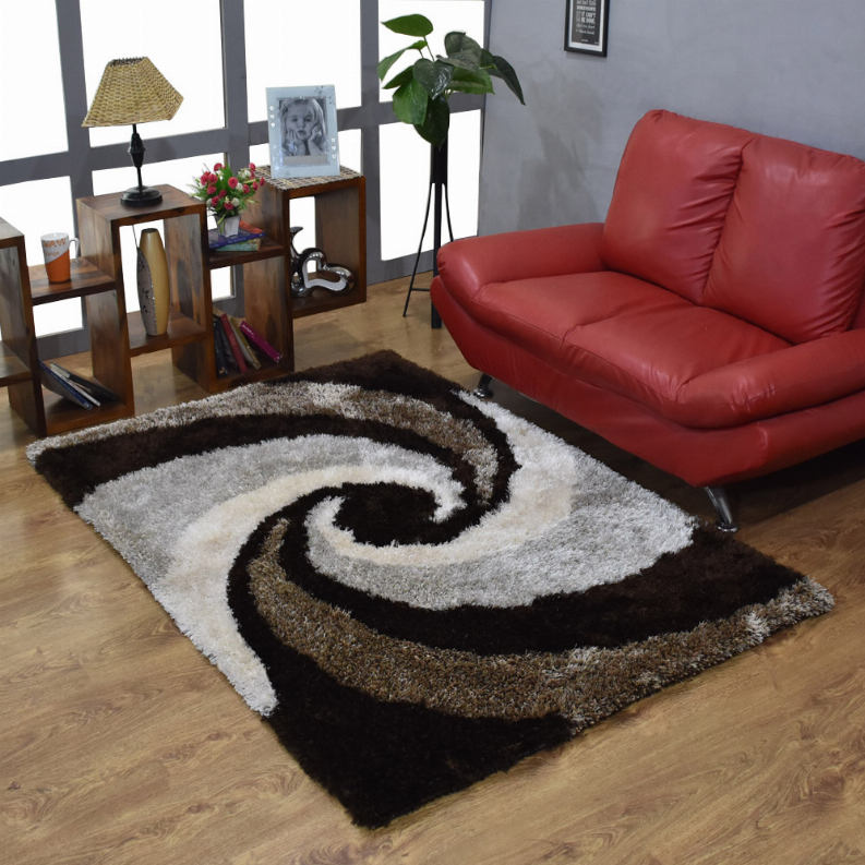 Shag area rug with swirling spiral motif in white, gray, black on dark base