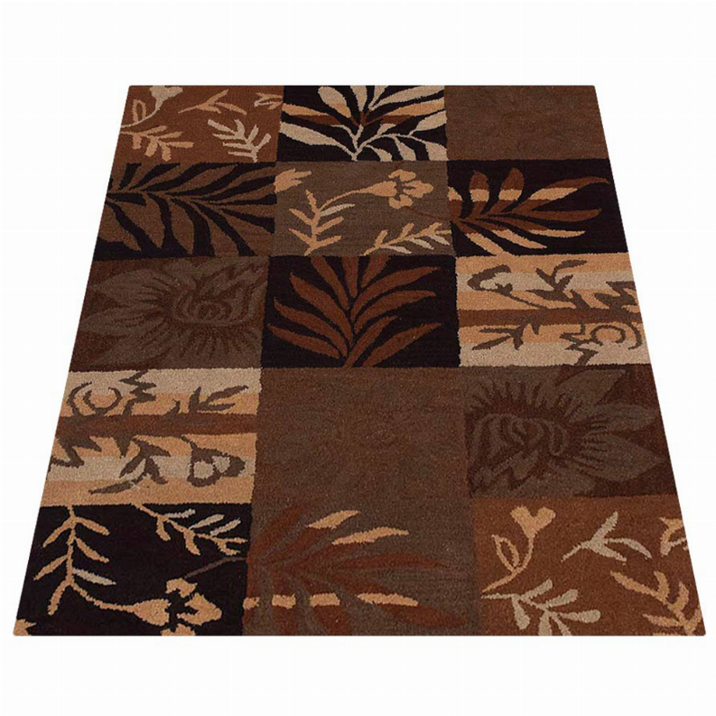 Rectangular patchwork area rug featuring botanical leaf motifs in brown and tan