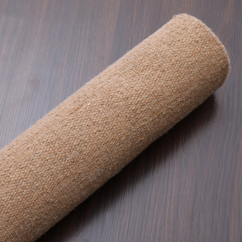 Rolled tan wool rug with flatweave kilim texture