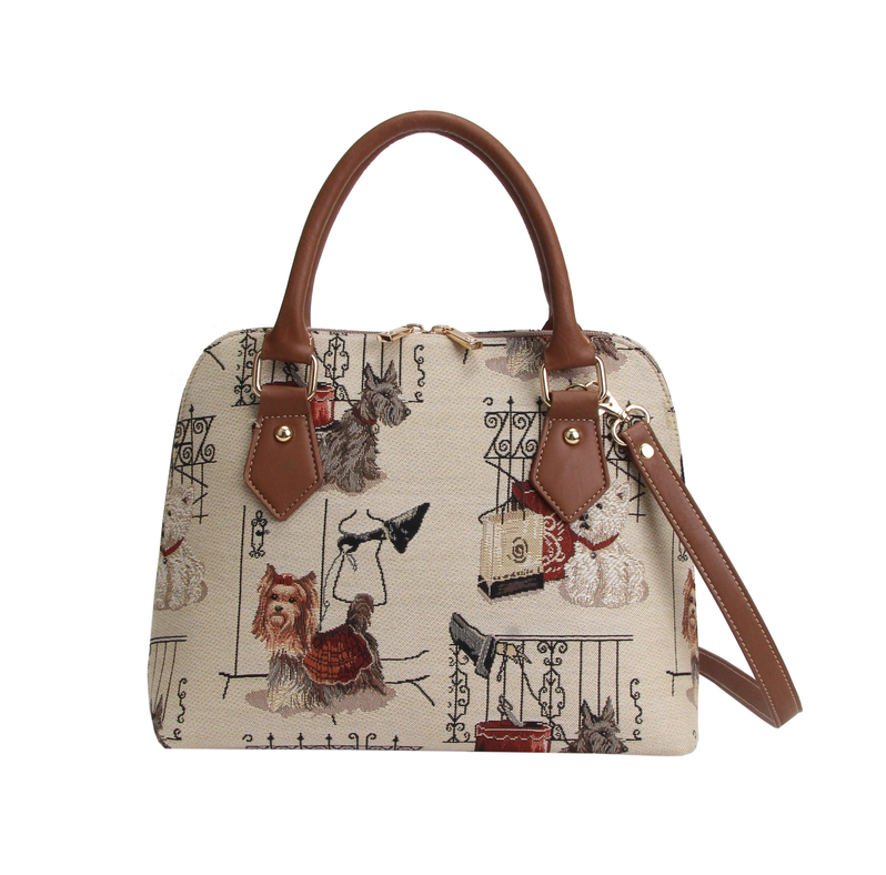 Dog-print top-handle handbag with tan leather trim and adjustable shoulder strap