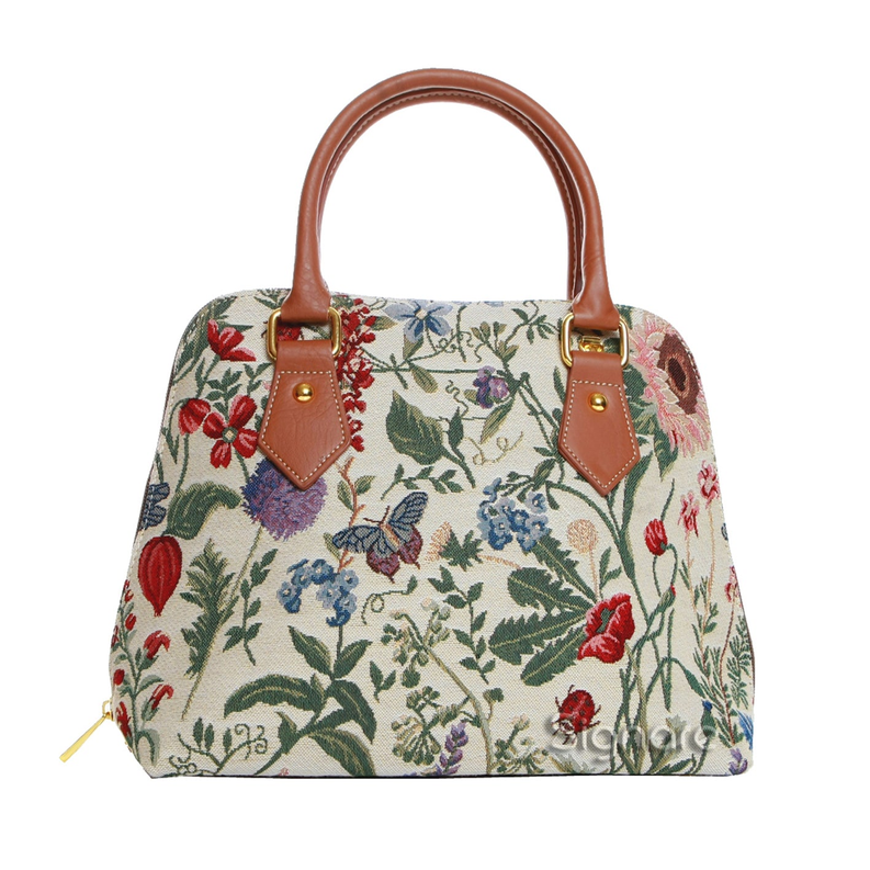 Floral canvas handbag with tan leather top handles and front pocket tabs